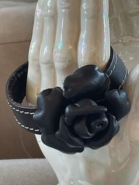 Black Fashion Jewelry Rose Cuff Bracelet with contrasting stitching.